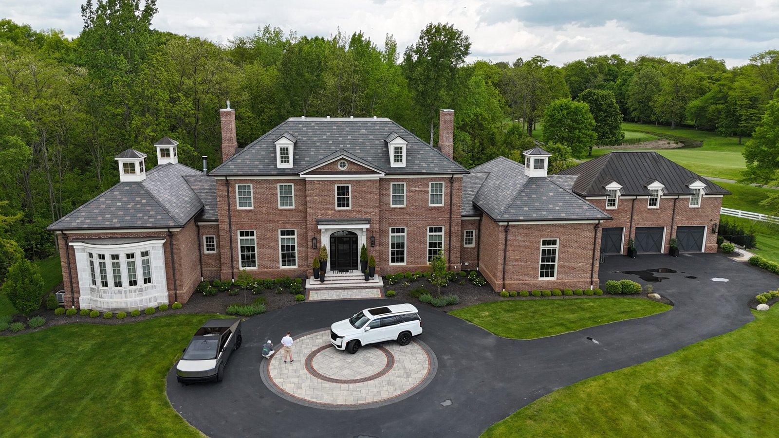 Large completed residential roofing project viewed by drone